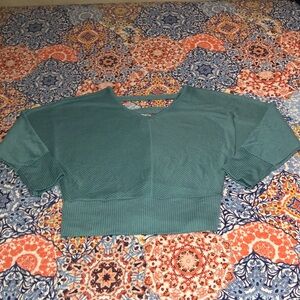 Teal plus size shirt with an open back; 2X